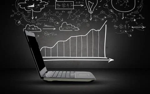 Open laptop computer with scheme and chart doodles Stock Photos