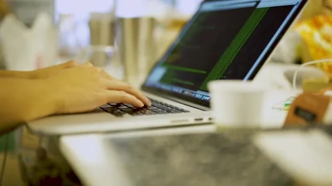 An open laptop computer sitting on top of a table Stock Footage 155533425