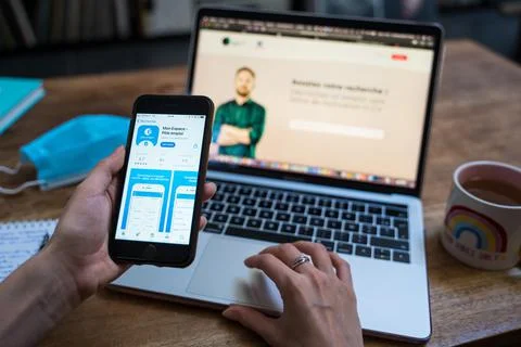 An open laptop computer sitting on top of a table Stock Photos