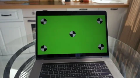 Open laptop with green chromakey screen on glass table Stock Footage 201184445