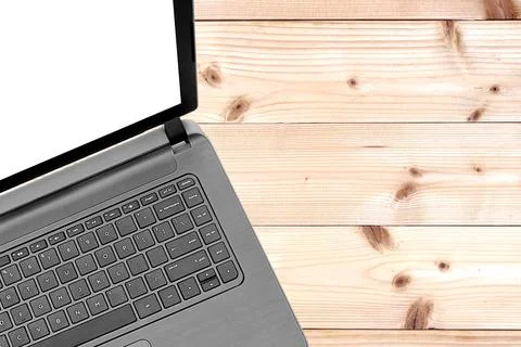 Open laptop with isolated screen on old wooden desk top view Stock Photos