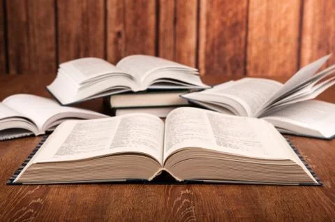 Open large book on a wood table Stock Photos