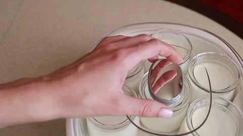 Open the lid of the yogurt maker Stock Footage 164404071
