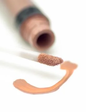 Open liquid concealer on a white background Stock Photos