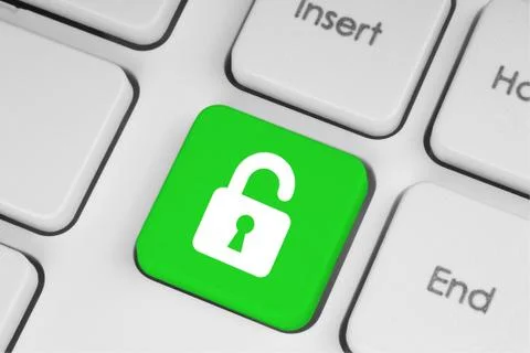Open lock green button on the keyboard. Stock Photos