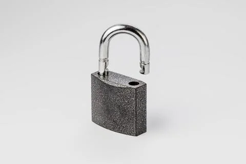 Open lock on grey background isolate Stock Photos