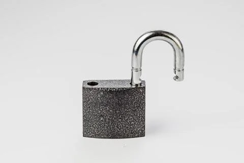Open lock on grey background isolate Stock Photos