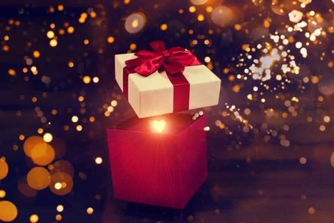 Open magic gift box dark background Stock Photos