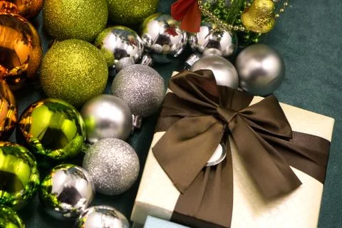 Open magic gift box on red background beautiful balls Stock Photos