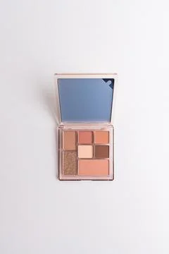 Open makeup eyeshadow palette with mirror isolated on a pure white background Stock Photos