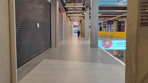 Open mall and shops on off-hours due to the Covid 19 pandemic. A woman walks Stock Footage 164825072