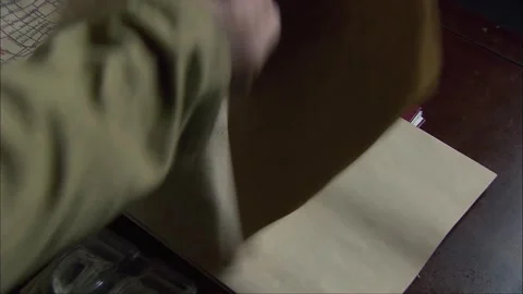 Open map on table Stock Footage 249512331