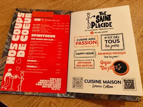 Open menu spread with red drinks brochure and white promotional flyer for T.. 写真素材