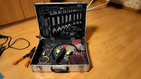 Open metal tool box with wrenches and equipment. Stock Photos