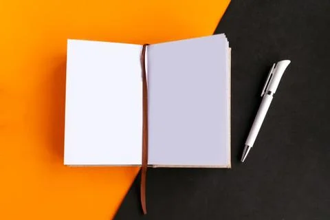 Open mockup notepad on geometric orange and black background, copy space for  Stock Photos