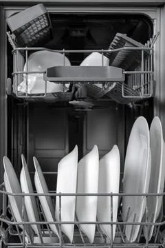 Open modern dishwasher with clean tableware, closeup Stock Photos