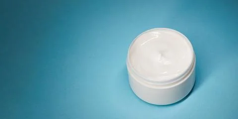 Open Moisturizer Cream Jar On Blue Background With Wide Copy Space Stock Photos