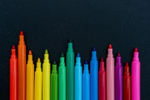Open multicolored markers. Stock Photos