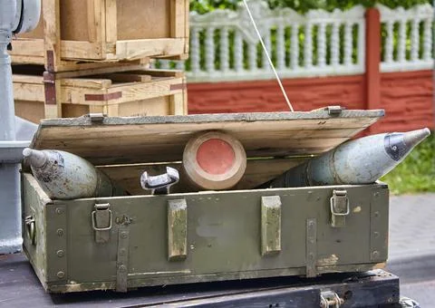 Open Munitions Crate In Front of Brick Wall Stock Photos