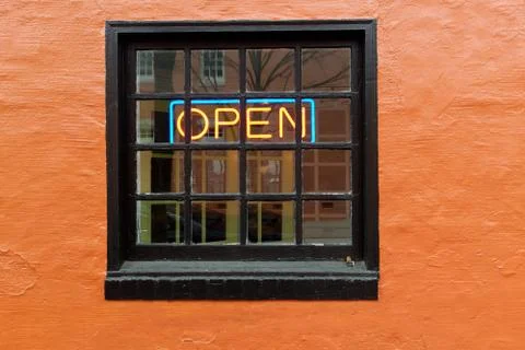 OPEN neon sign inside window Stock Photos