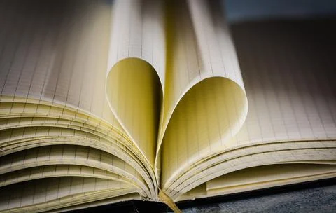 Open note book with two heart shaped pages isolated with copy space Stock Photos