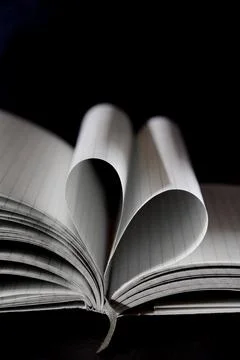Open note book with two heart shaped pages isolated with copy space Stock Photos