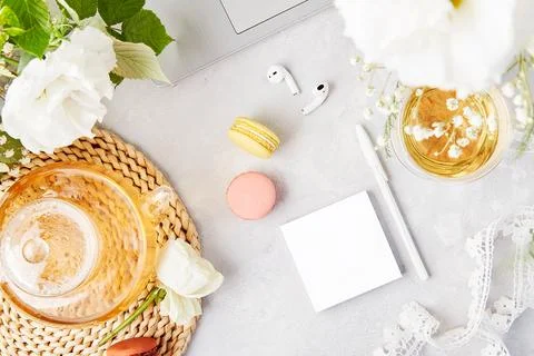 Open note mock up, herbal tea and earphones. Freelance, to do list, shopping Stock Photos