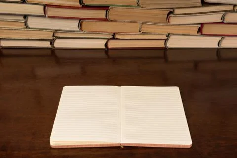 Open notebook on the background of books Stock Photos