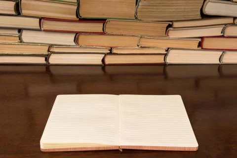 Open notebook on the background of books Foto stock