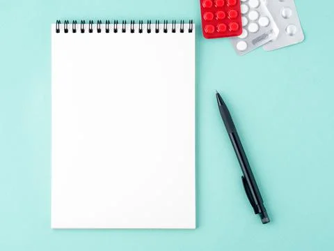 Open notebook with blank white clean page to write the treatment plan of the Stock Photos