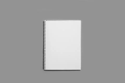 An open notebook on a blank white page on a gray background with copy space Stock Photos