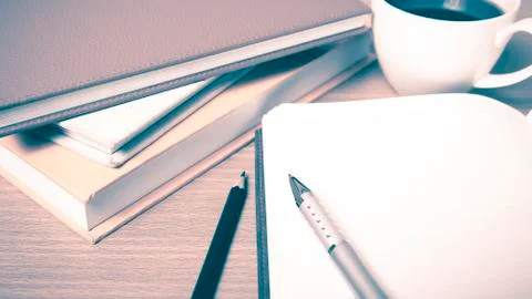 Open notebook with book and coffee cup  vintage style Stock-Fotos