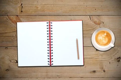 Open notebook with cup of coffee Stock Photos