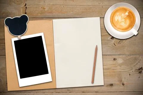 Open notebook with cup of coffee Stock Photos
