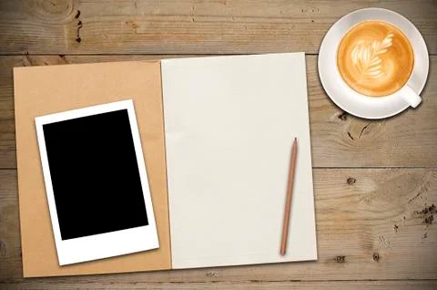 Open notebook with cup of coffee Stock Photos