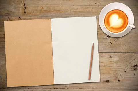 Open notebook with cup of coffee Stock Photos