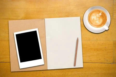 Open notebook with cup of coffee Stock Photos