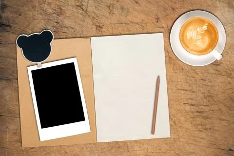 Open notebook with cup of coffee Stock Photos
