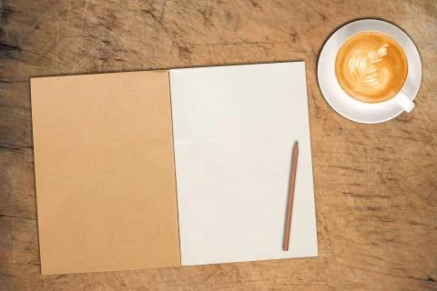 Open notebook with cup of coffee Stock Photos