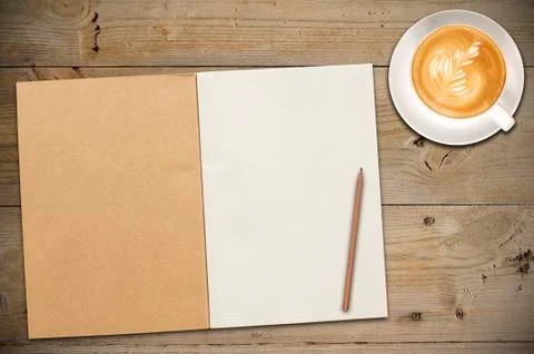 Open notebook with cup of coffee Stock Photos