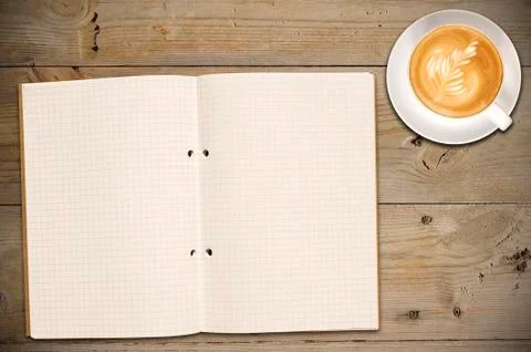 Open notebook with cup of coffee Stock Photos