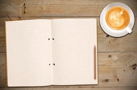 Open notebook with cup of coffee Stock Photos
