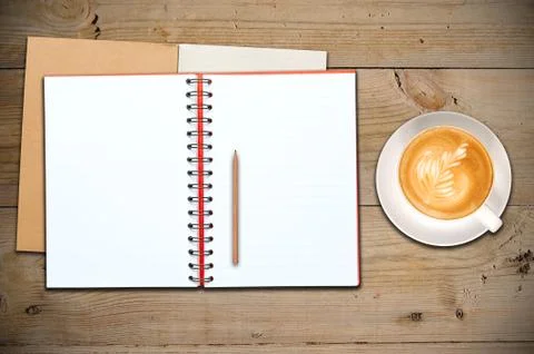 Open notebook with cup of coffee Stock Photos