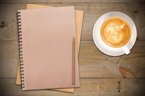 Open notebook with cup of coffee Stock Photos