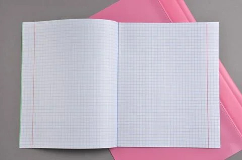 An open notebook lies on the table. Stock Photos