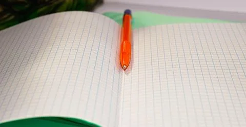An open notebook in a math box with a pen on it. The concept of learning. Stock Photos