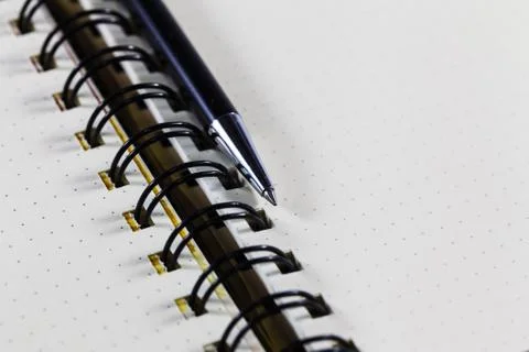 Open notebook with pen on clean sheets Stock Photos