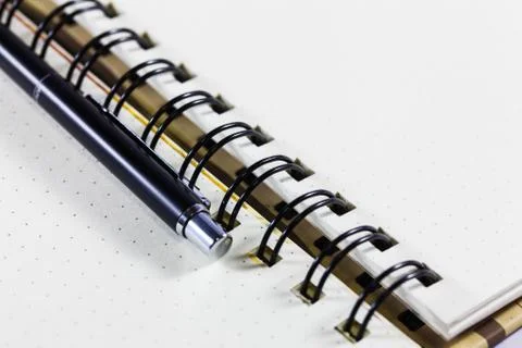 Open notebook with pen on clean sheets Stock Photos