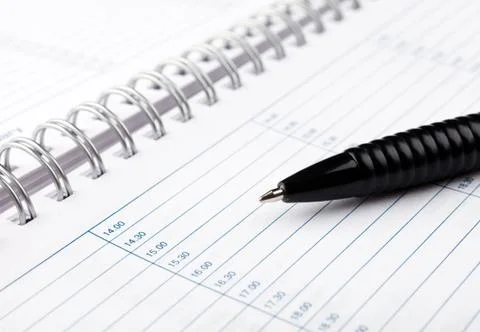 Open notebook with pen Stock Photos