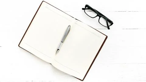 Open notebook with pen Stock Photos